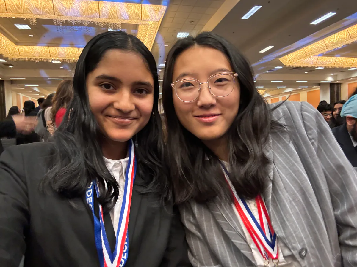 Erika Wu with a DECA competitor after the awards ceremony
